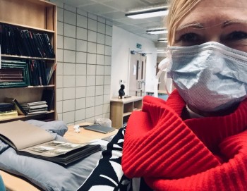Janet Remmington wearing a face covering in the Borthwick Institute archives